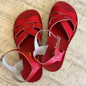 Saltwater/sun-san boardwalk sandals. Red sandals leather upper and lining.